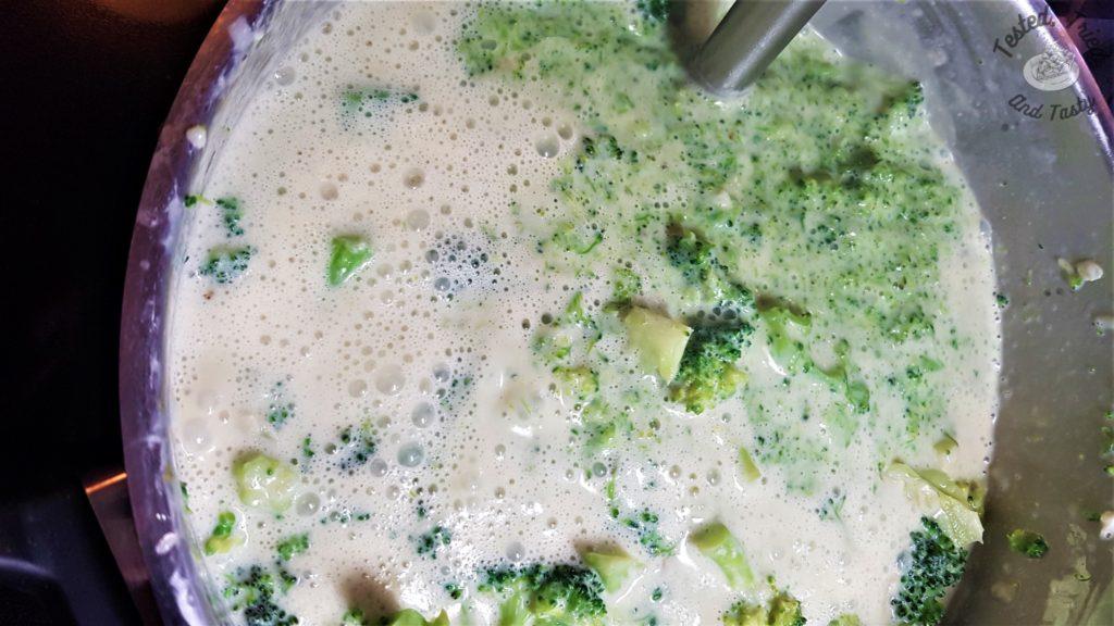 Blending up the broccoli cheddar soup with a hand blender.