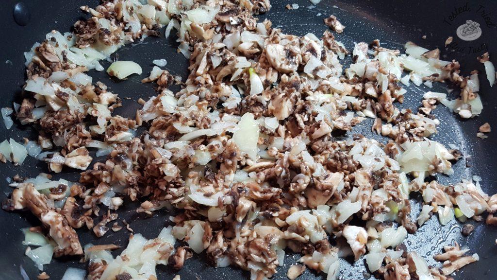 mushrooms and onions cooking in butter