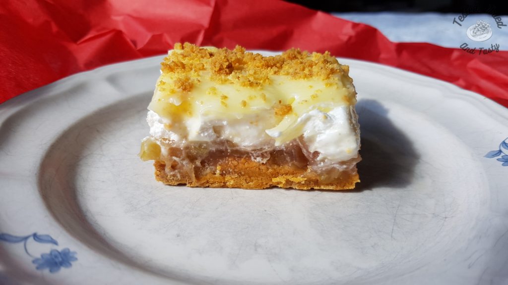 Rhubarb Torte with pudding on a plate.