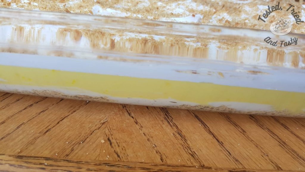 Lemon Lush Pudding Dessert on a wooden table.