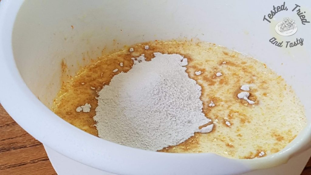 Instant butterscotch pudding and milk in a white bowl.