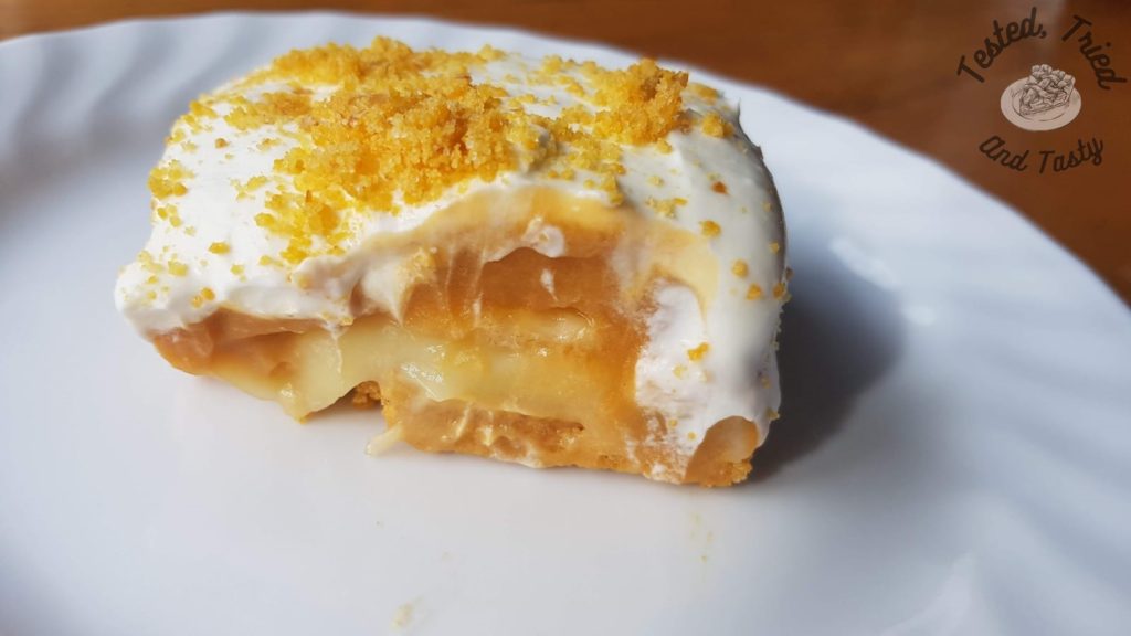 Banana cream pie bar on a white plate.