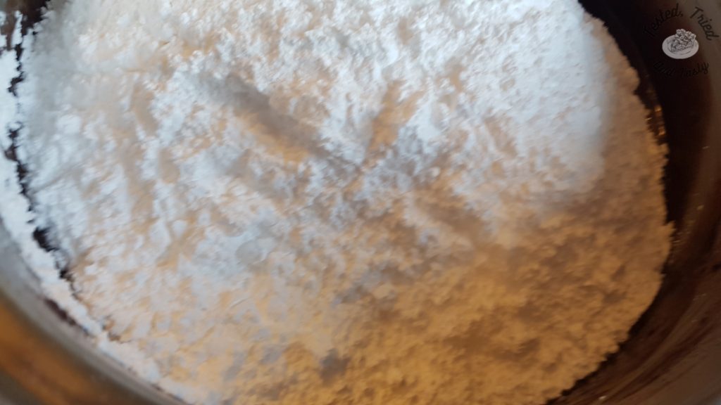 Icing sugar added to the butter, milk and cocoa mixture.