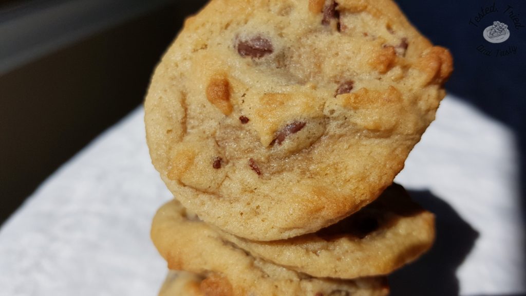 Chocolate chip cookies on a white tablecloth.