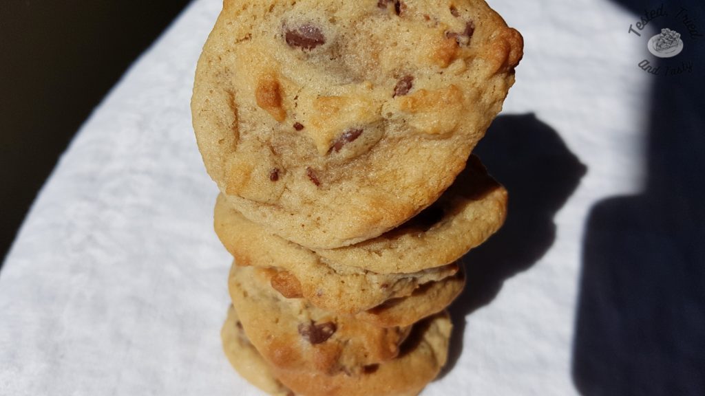 Chocolate chip cookies on a white tablecloth.