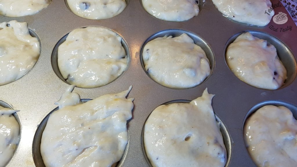 Muffin tin filled with batter ready for baking.