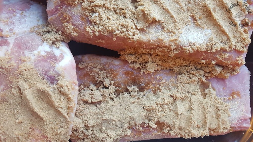Pork shoulder and pork loin with garlic salt, brown sugar and liquid smoke on it.