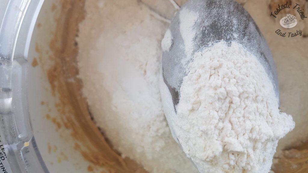 Flour and cookie dough in a bosch mixer.