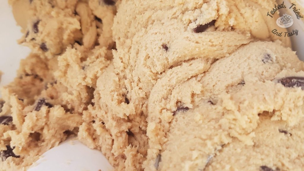 Chocolate chip cookie dough in a bosch mixer.
