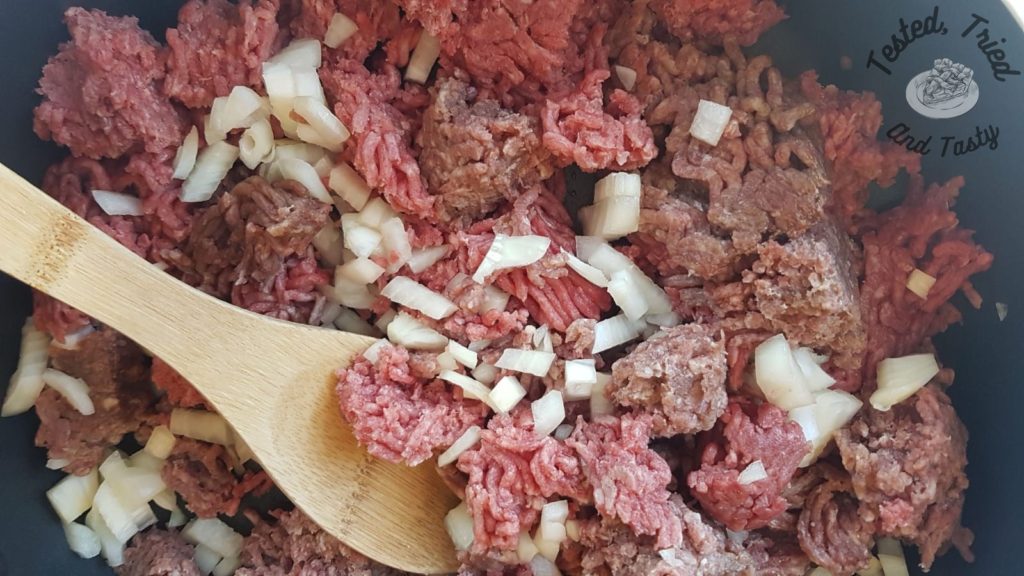 Ground Beef and onions in a large skillet.