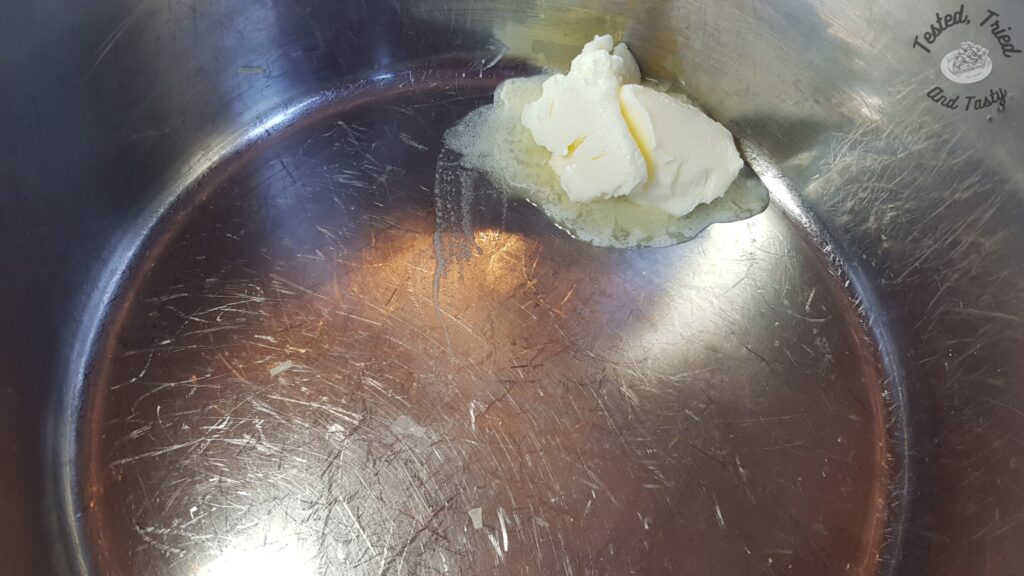 Butter in a large saucepan.