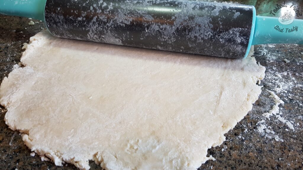 Rolling out the dough for pie.