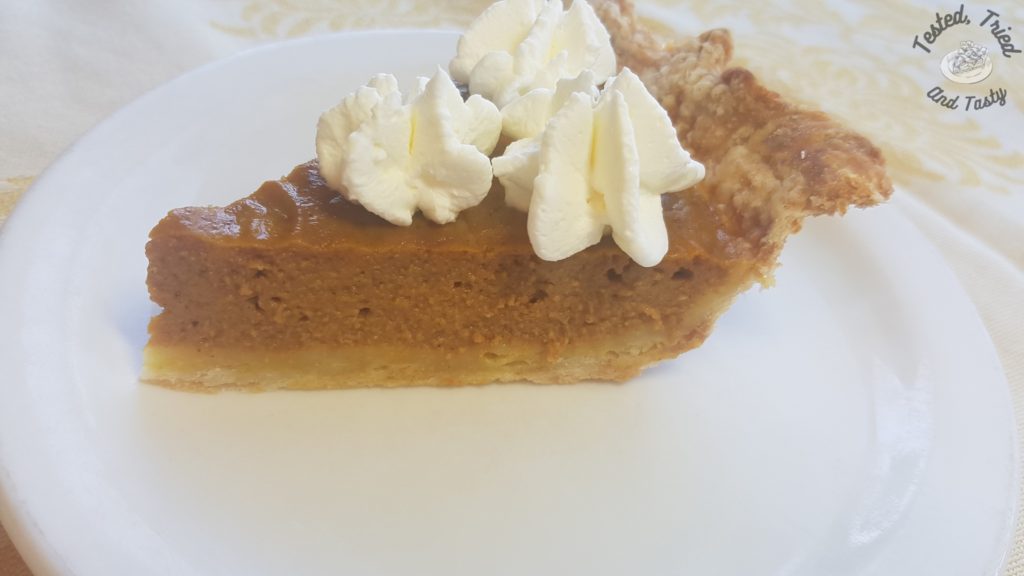 Pumpkin pie with sweetened whipped cream.