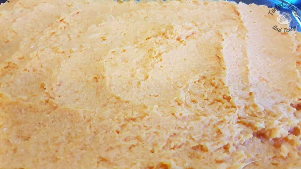 Sweet potato mixture spread in a 9x13 inch pan.