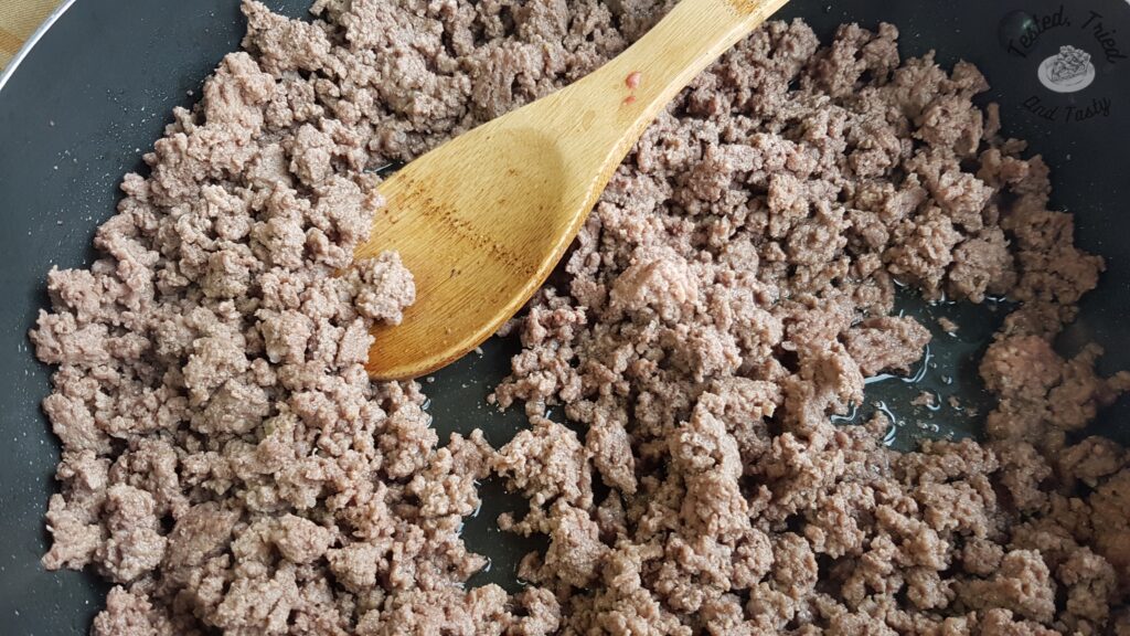 Ground beef browned in a large saucepan.