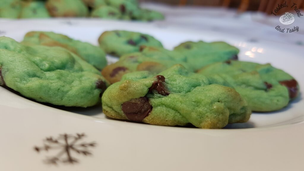 Mint chocolate chip cookies on a christmas plate.