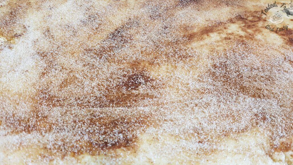 Cinnamon sugar sprinkled on the melted butter.
