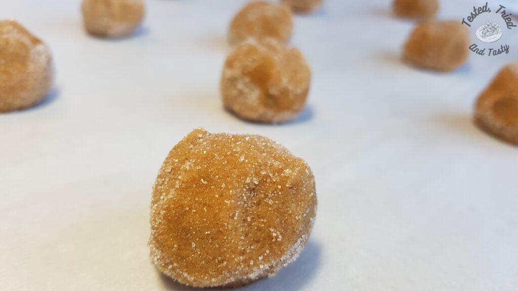Molasses cookie balls ready to be baked.