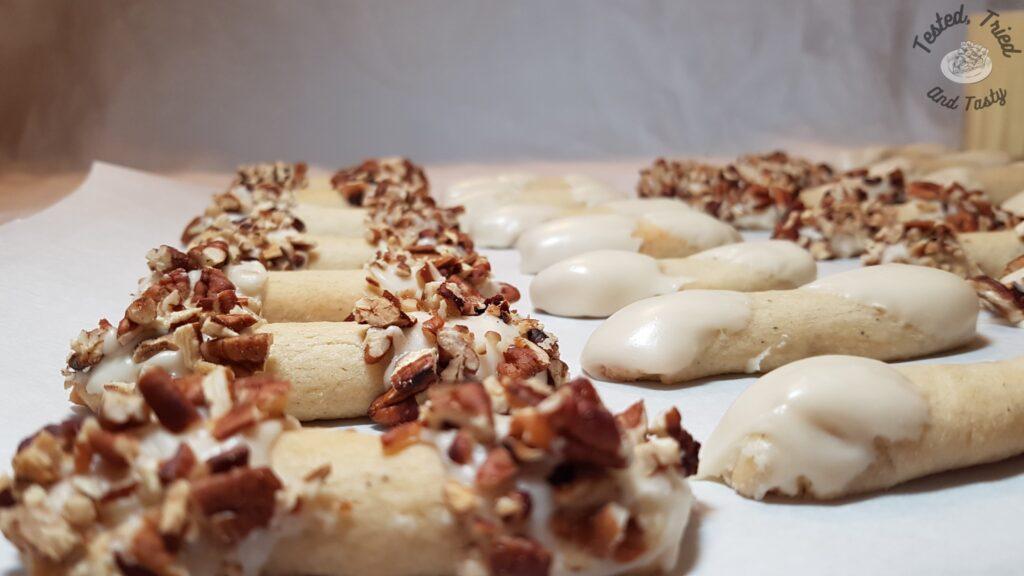 Eggnog cookies finished with and without pecans.