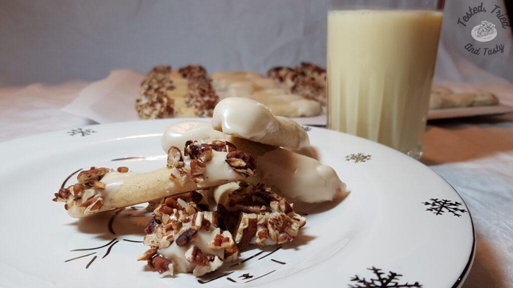 Eggnog log cookies with a glass of eggnog.