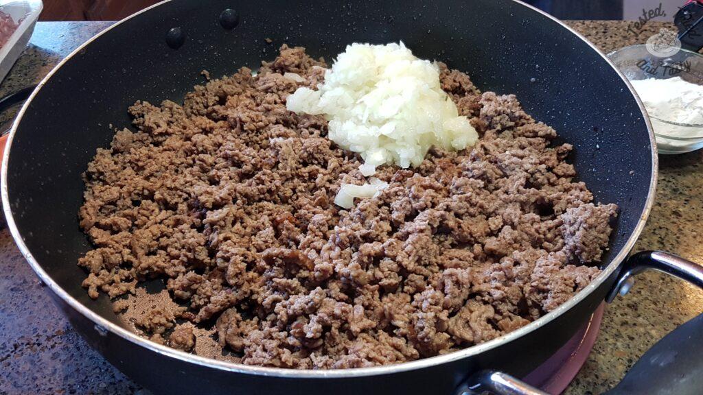 Ground beef in a large saucepan.