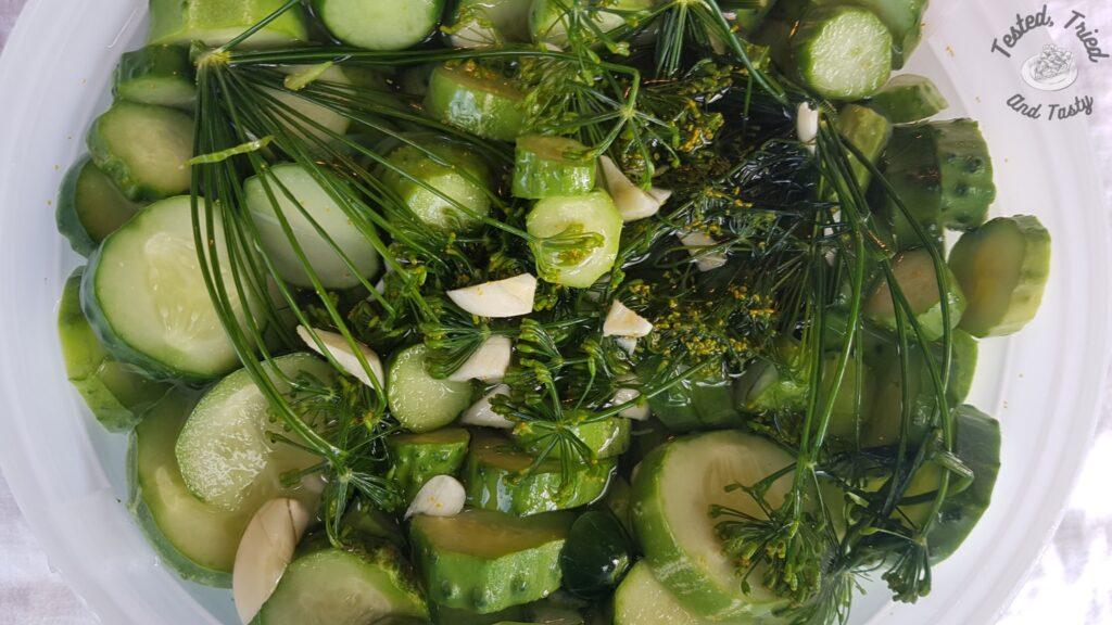 Refrigerator pickles in an ice cream pail.