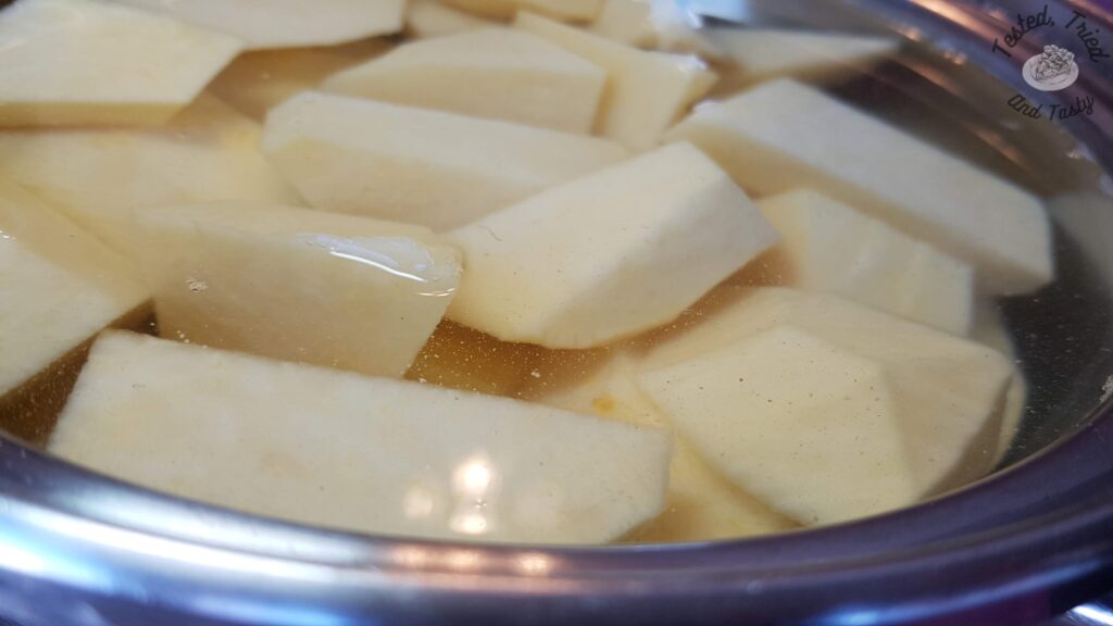 Rutabaga in a pot of water ready to be cooked.
