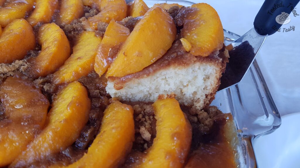 A piece of peach kuga cake being served.