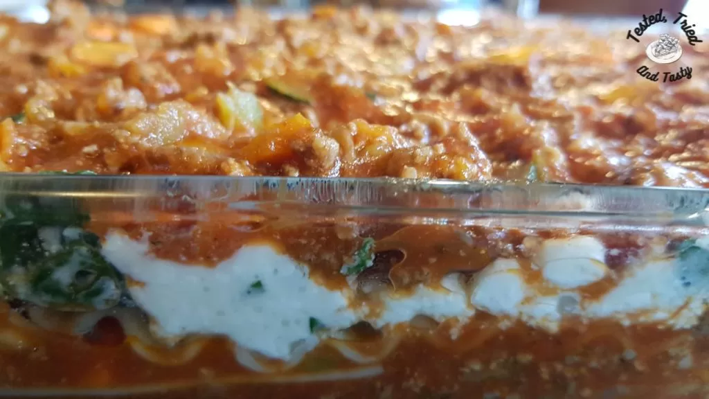 Tasty baked lasagna in a glass casserole dish.