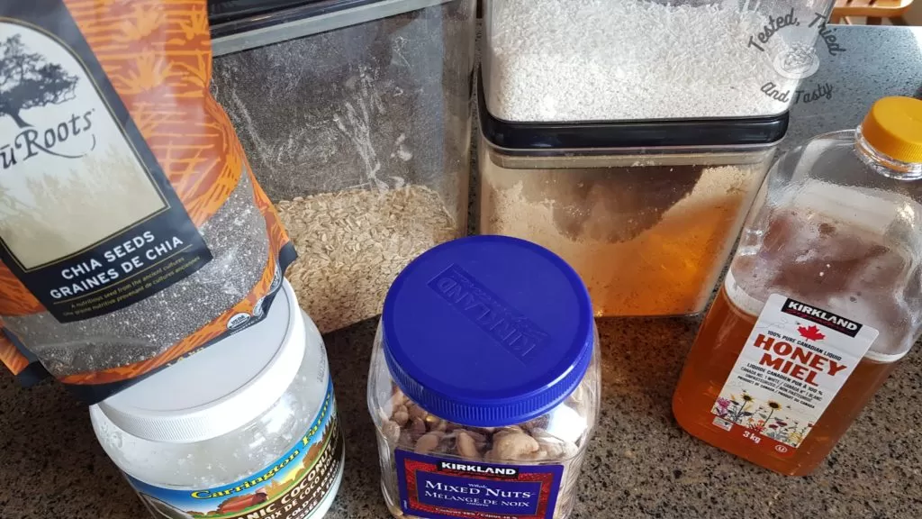 Ingredients for granola,honey, brown sugar, coconut, coconut oil, nuts, oats, chia seeds
