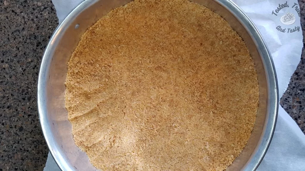 gingersnap crumbs and graham crumbs for the crust of blueberry cheesecake with a gingersnap crust.