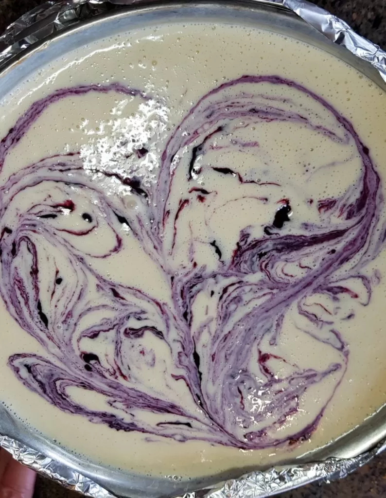 blueberry cheesecake with a gingersnap crust poured into the springorm pan.