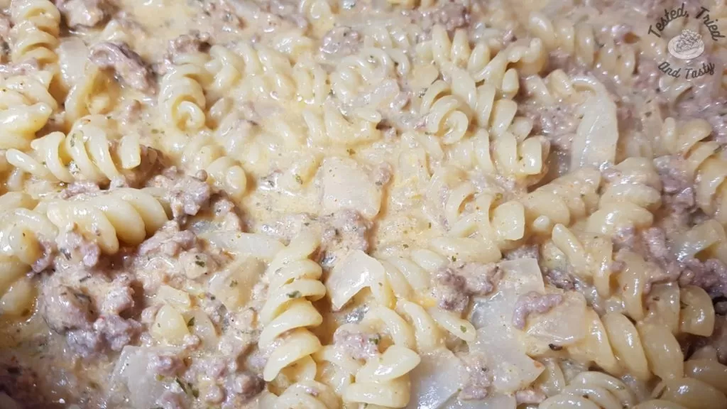 Pasta cooked in the meat, onion, milk sauce.