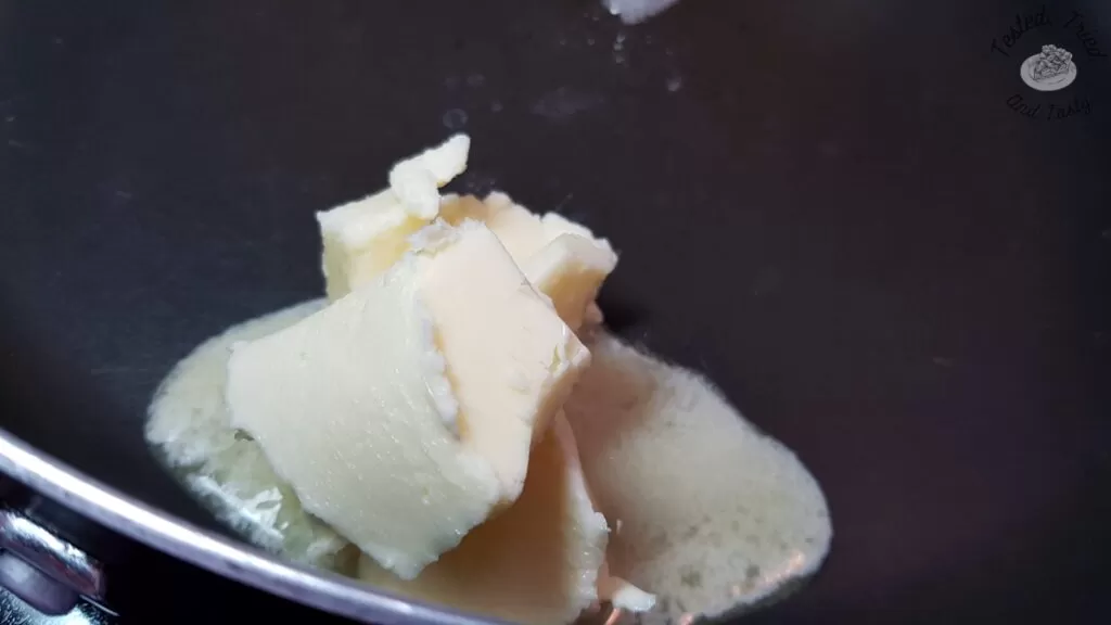 Butter melting in a large saucepan.