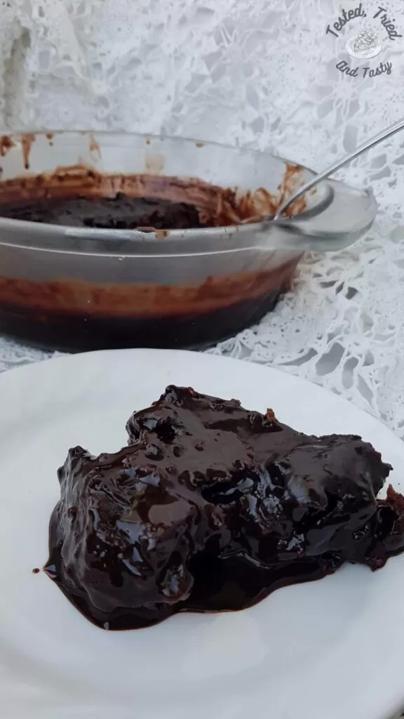 Chocoholic pudding cake on a white plate.