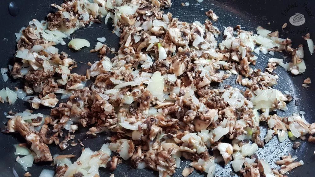 mushrooms and onions cooking in butter