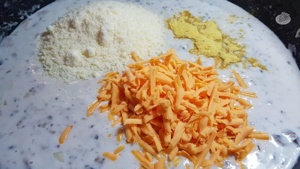 Mornay Sauce with mushrooms and onions. Parmesan and cheddar cheese and chicken bouillon added to it.