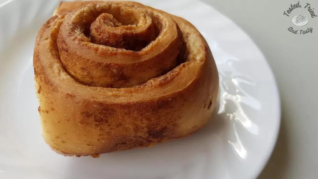 Easy homemade cinnamon roll on a white plate