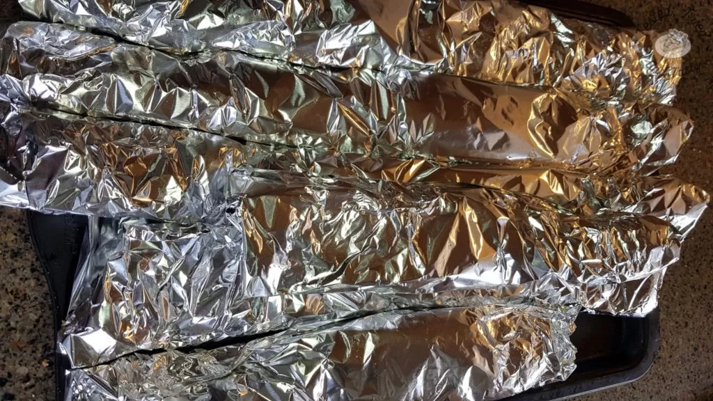 ribs wrapped in foil ready for cooking