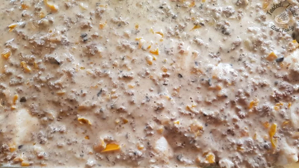 perogies and sauce layered for delicious perogy casserole