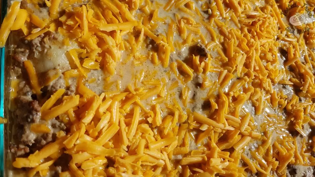 grated cheese on the top of delicious perogy casserole