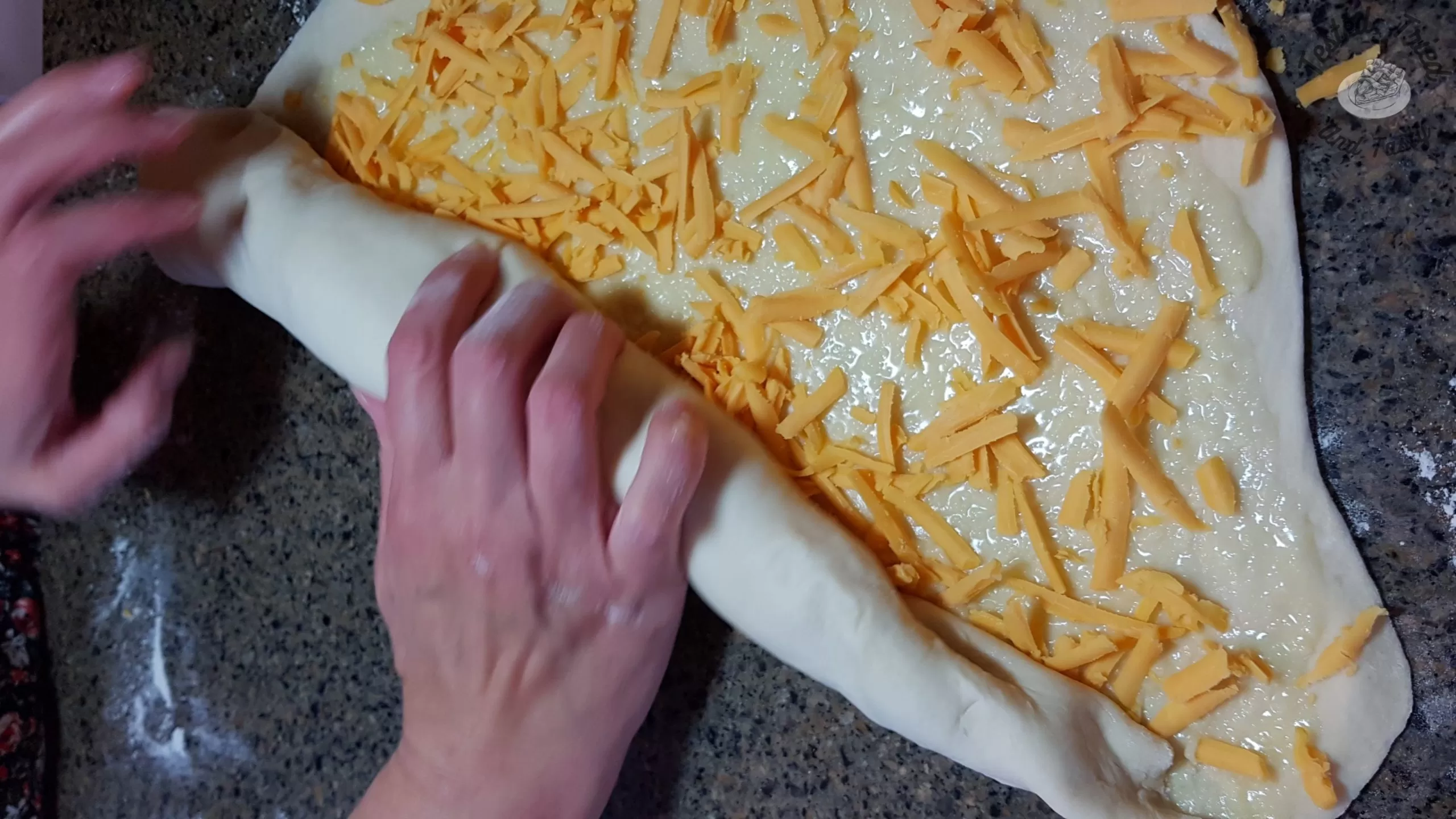 rolling up dough for garlic cheese buns