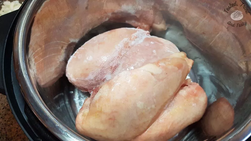 Frozen chicken breasts in an instant pot.