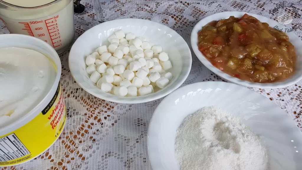 Ingredients for Rhubarb Torte with Pudding recipe on a white lace tablecloth.