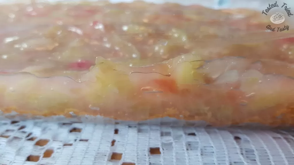 Close up of rhubarb layer on top of graham wafer crust.