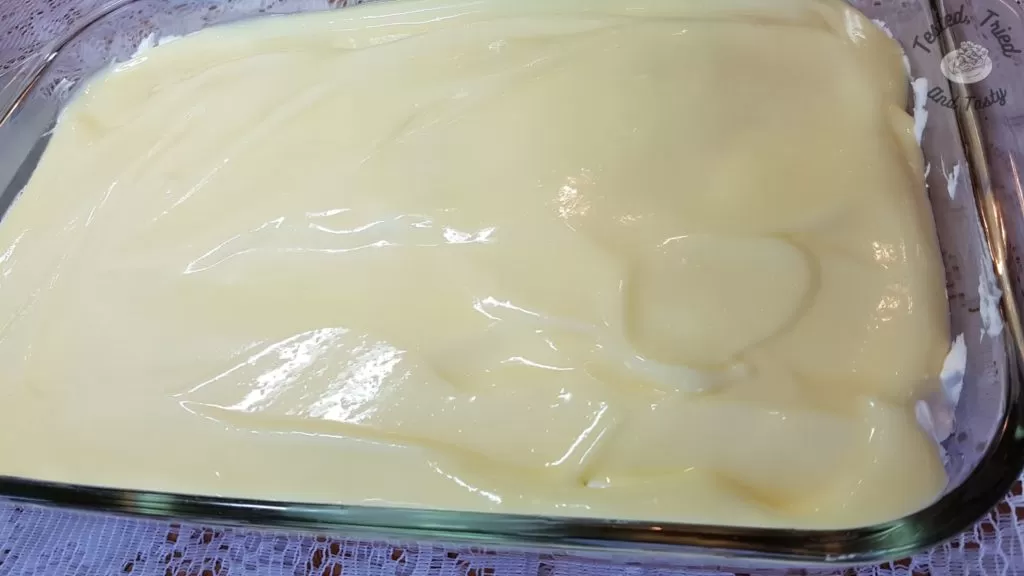 Vanilla pudding layer on top of Rhubarb Torte with Pudding.