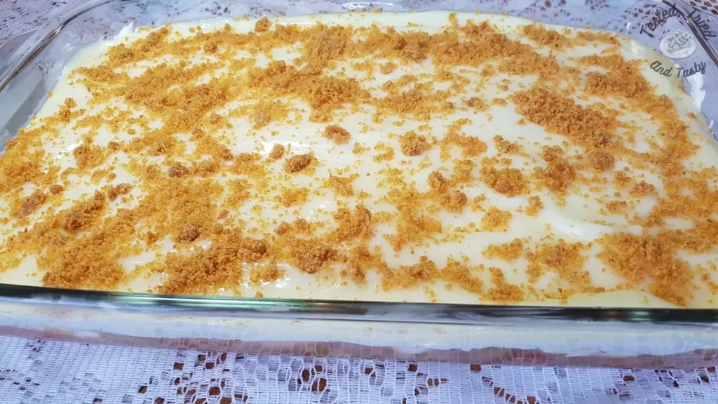 Rhubarb Torte with Pudding finished on a white lace tablecloth.