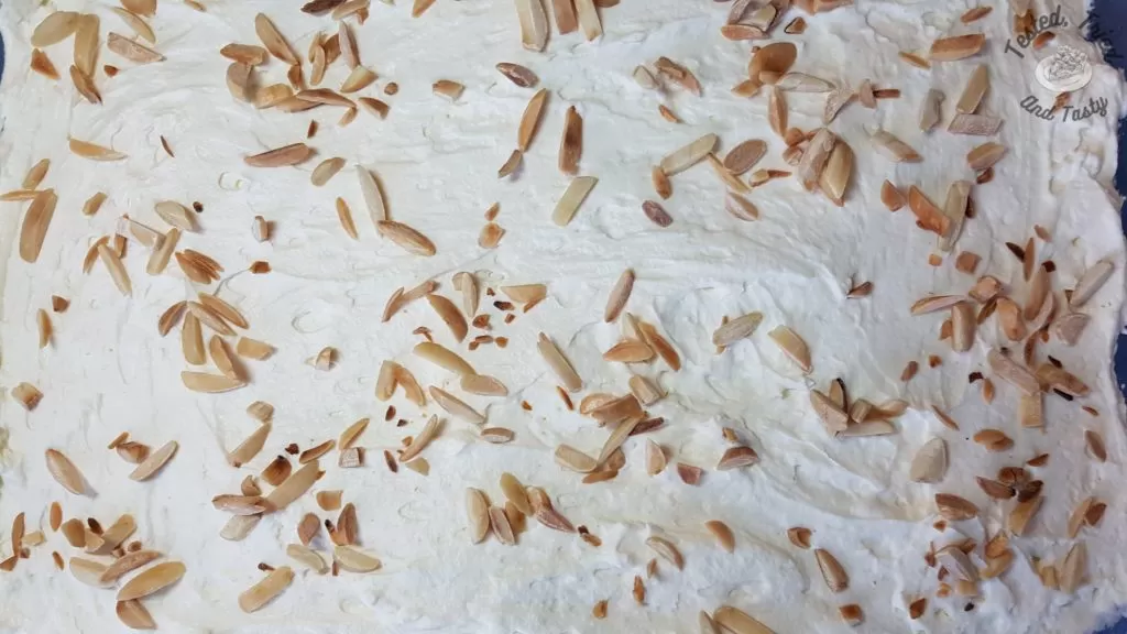 Toasted slivered almonds on the top of the pistachio pudding dessert.