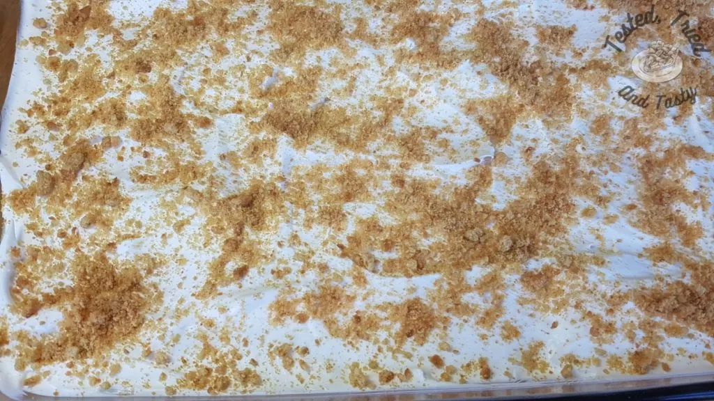 Crushed gingersnaps on lemon lush pudding desert.