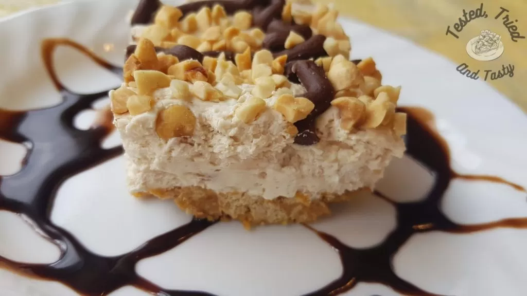Frozen Drumstick Dessert on a white plate with chocolate drizzle.